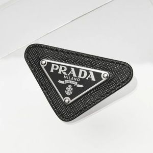 Prada enameled triangle pin with Saffiano trim Authentic